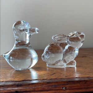 Glass duck and bunny paperweights selling as a bundle.